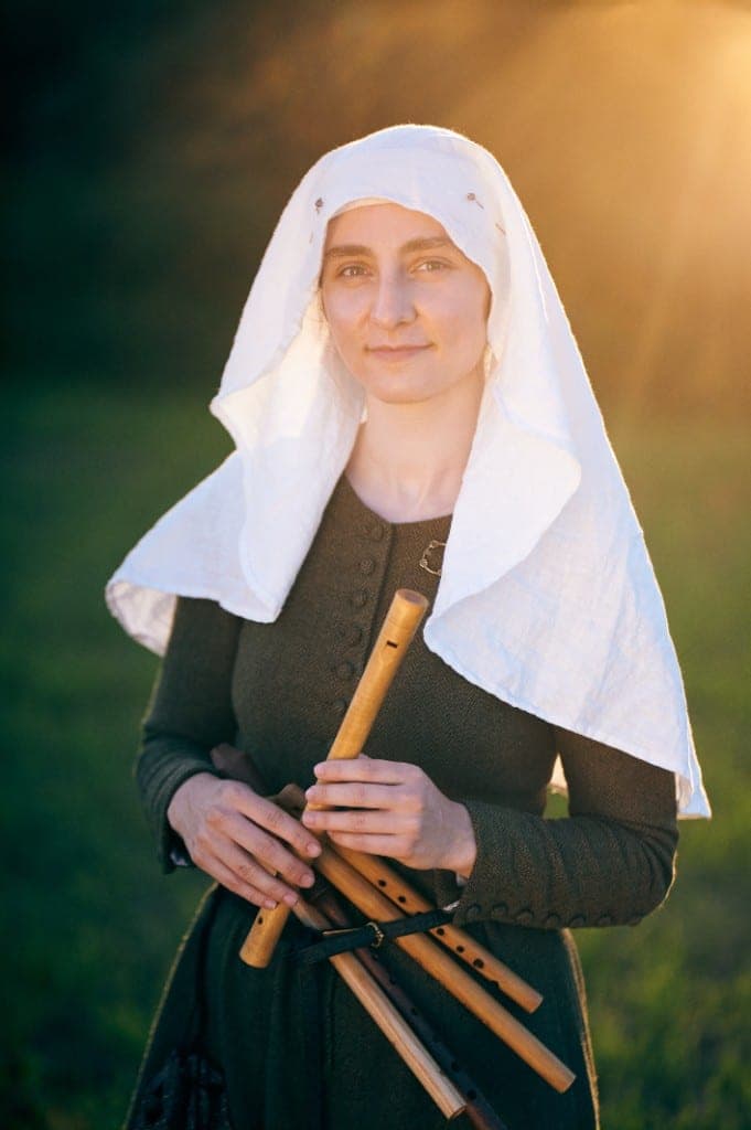 Musician with recorders at sunset